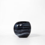 Buddy pet urn. Image of organic marbled urn in black.