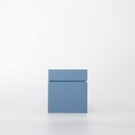 Buddy pet cremation urn. Image of modern cube urn in ocean.